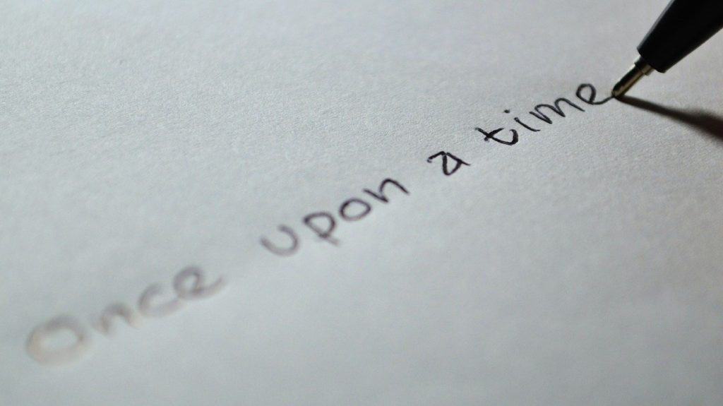 Written words 'once upon a time' written on paper