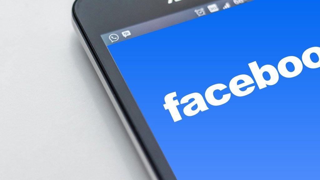 Facebook logo on smartphone screen