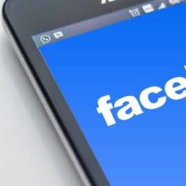 Facebook logo on smartphone screen