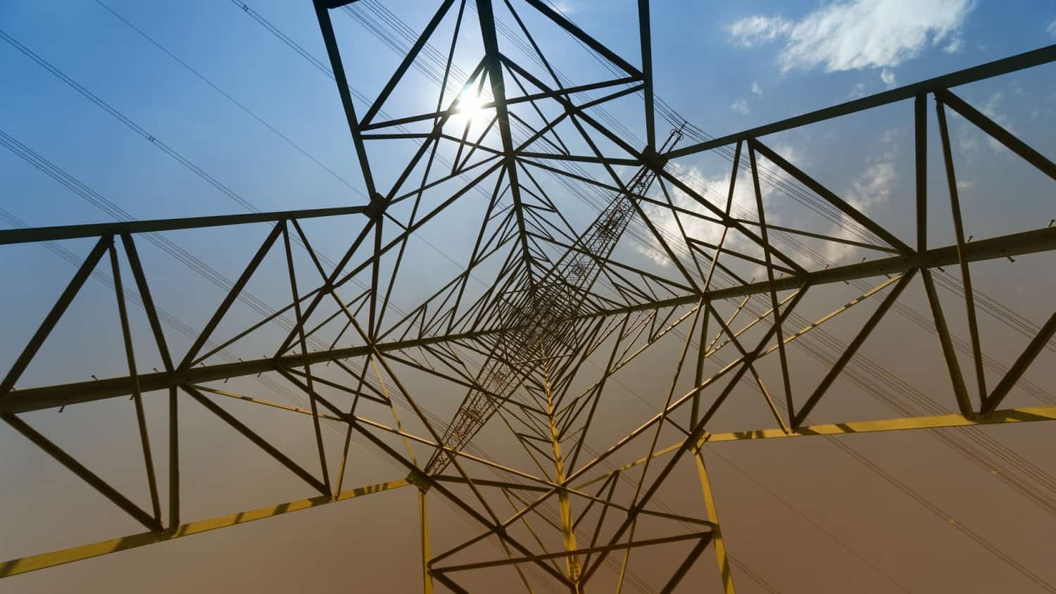 View from ground looking up into centre of electricity pylon