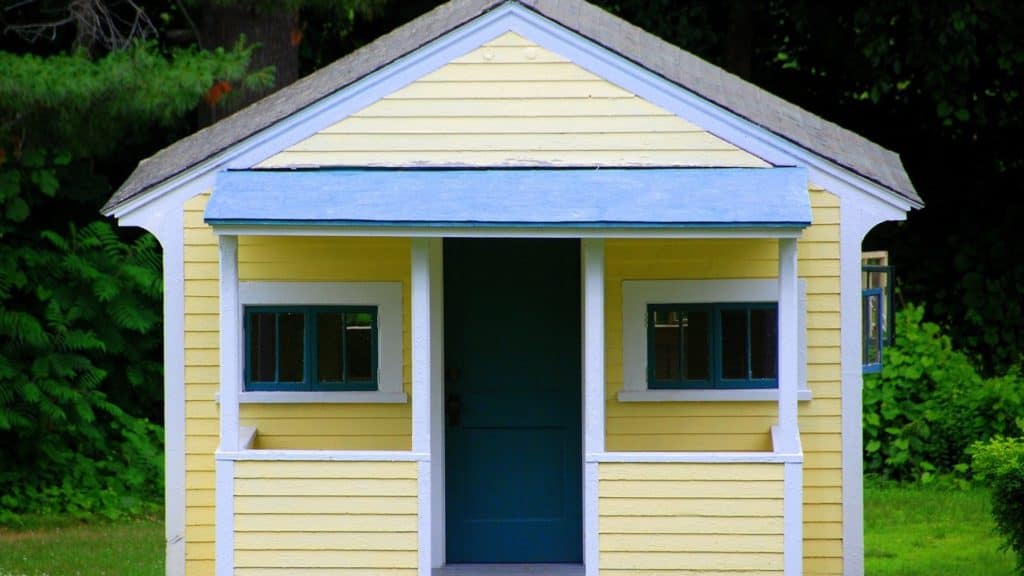 Blue-and-yellow wooden summer house