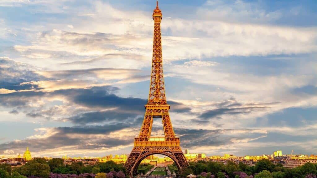 Eiffel tower against a lightly cloudy evening sky