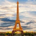 Eiffel tower against a lightly cloudy evening sky