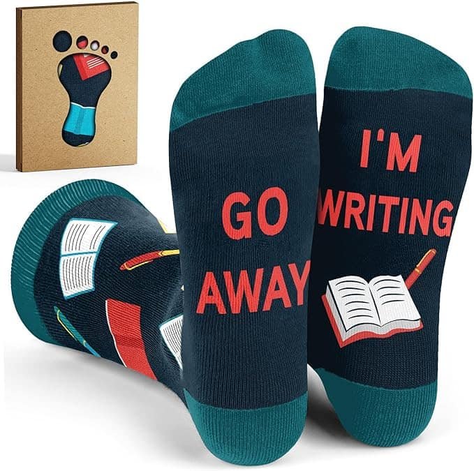 Green-and-blue socks with words on soles: "Go away, I'm writing"